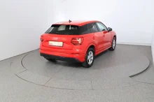 Audi Q2 30 TDI intense in tangorot metallic