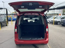 VW Caddy Family TSI in Sunsetred Metallic